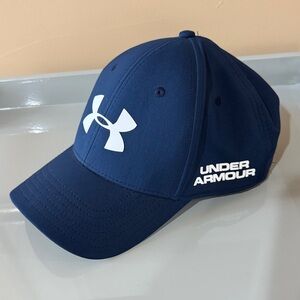 Under Armour sized blue golf hat with white logo.